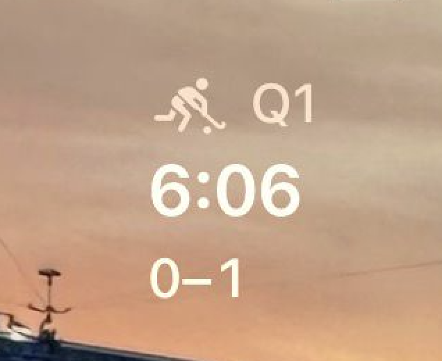 Enlarged zoom of lock screen widget detail with match timer and score